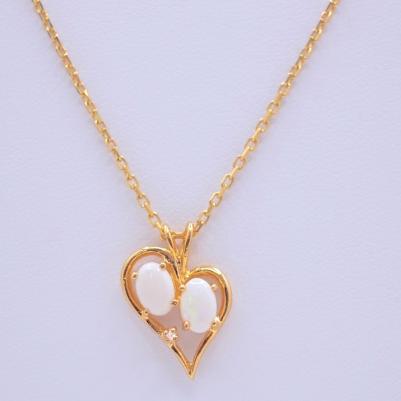 14K Heart pendant with opal stones paired with a necklace. - Picture 3 of 3